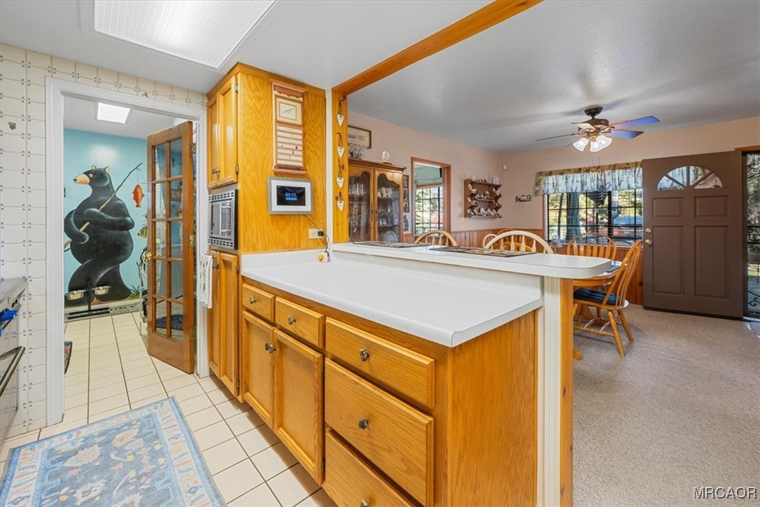 446 Moreno Lane Sugarloaf, CA 92386 - Photo 14 of 41 a view of a kitchen area with furniture and wooden floor