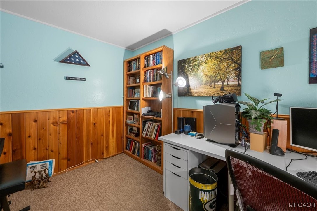 446 Moreno Lane Sugarloaf, CA 92386 - Photo 23 of 41 a view of a workspace with furniture and a flat screen tv