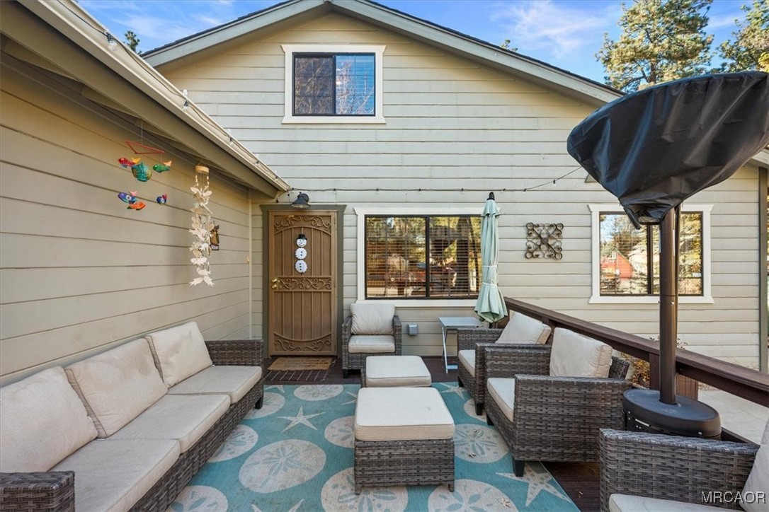 446 Moreno Lane Sugarloaf, CA 92386 - Photo 5 of 41 a balcony with furniture and a potted plant