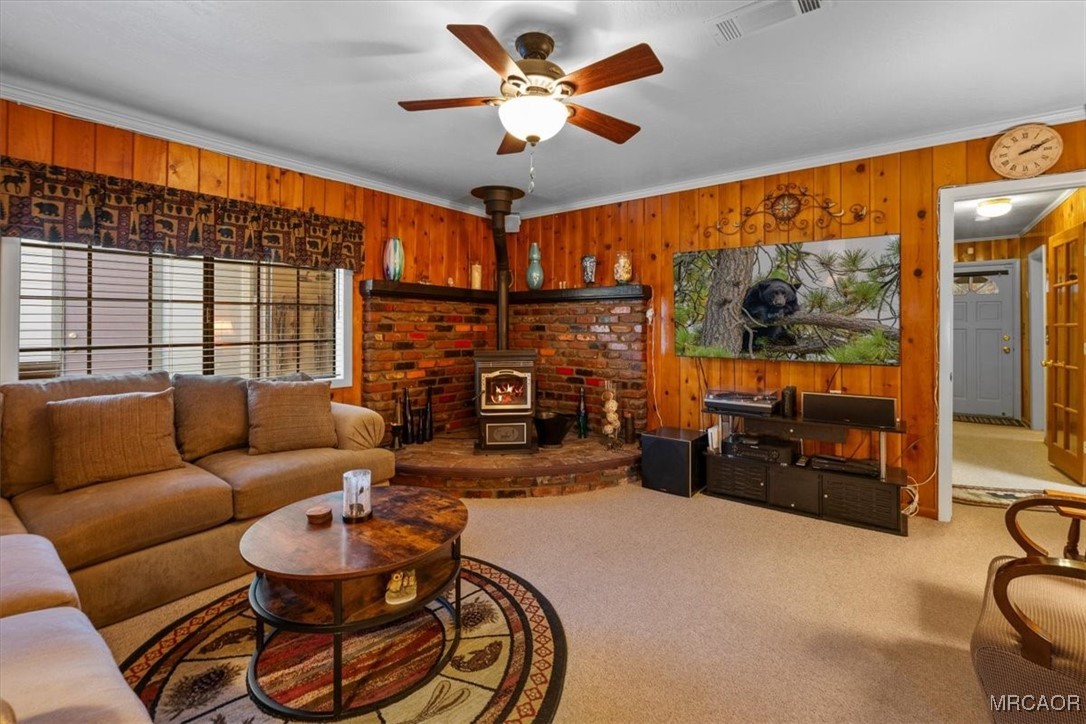 446 Moreno Lane Sugarloaf, CA 92386 - Photo 6 of 41 a living room with fireplace furniture and a flat screen tv