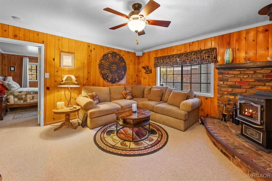 446 Moreno Lane Sugarloaf, CA 92386 - Photo 7 of 41 a living room with fireplace furniture and a large window