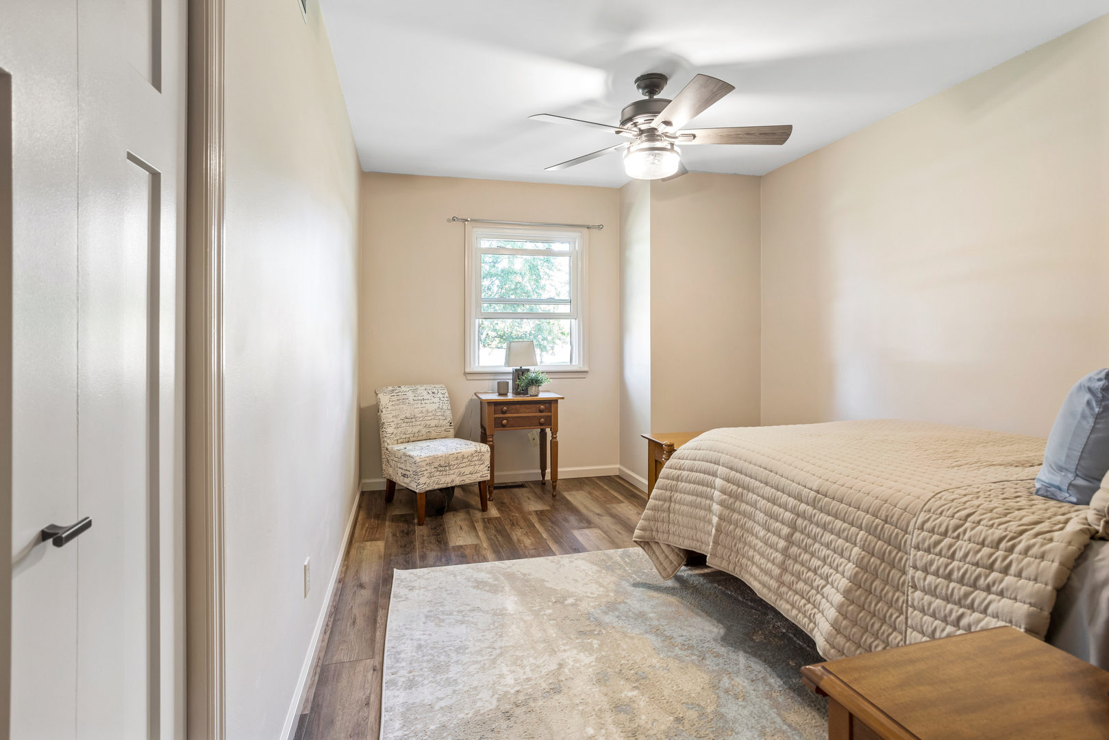 24 Crestview Court Fisher, IL 61843 - Photo 20 of 42 a bedroom with a bed and a chandelier