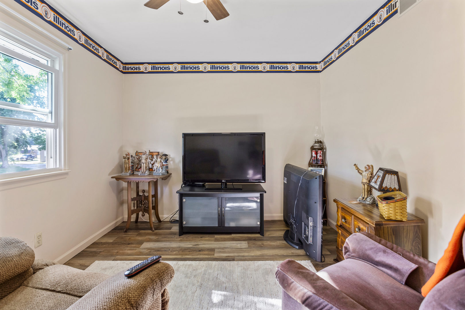 24 Crestview Court Fisher, IL 61843 - Photo 22 of 42 a living room with furniture and a flat screen tv
