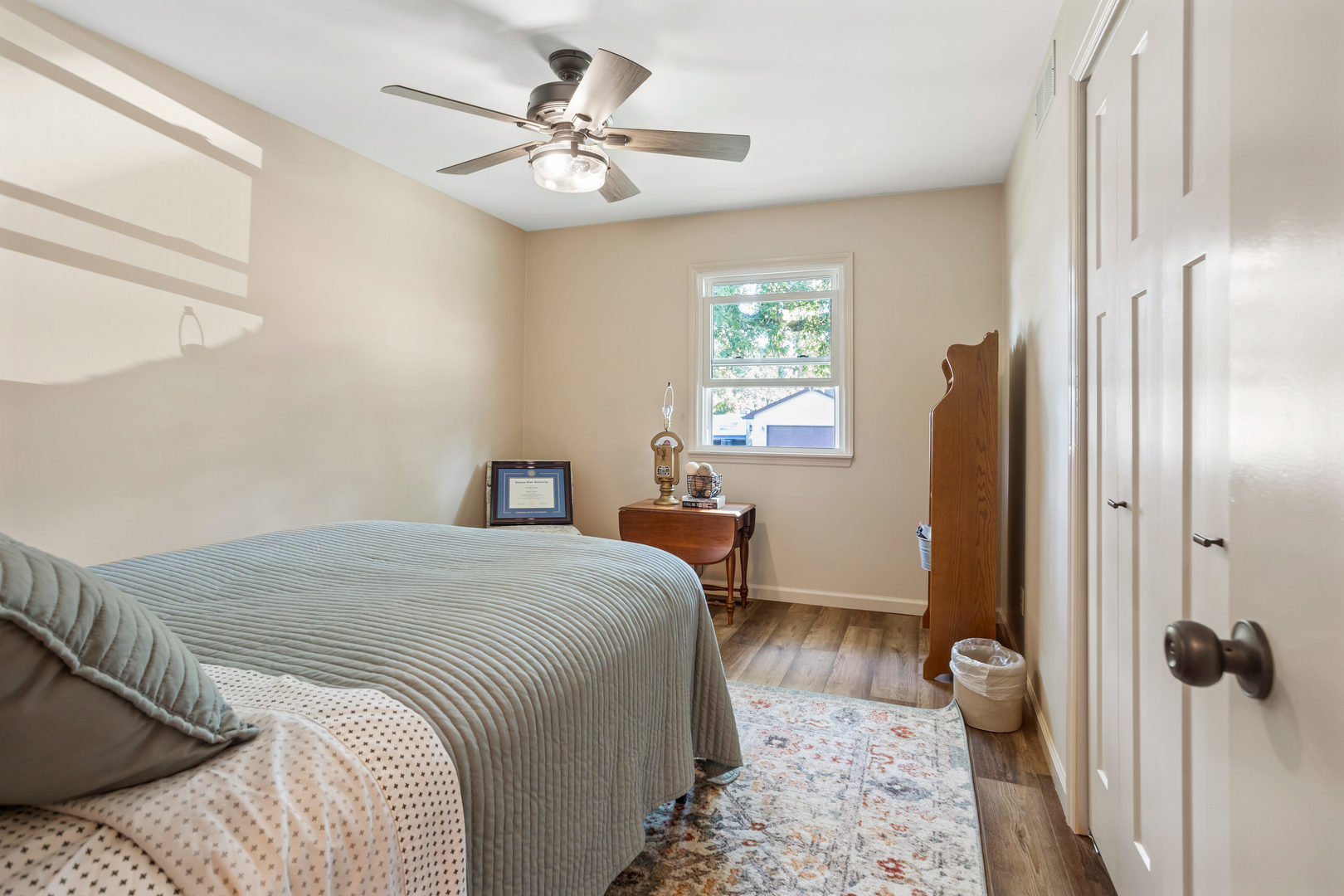 24 Crestview Court Fisher, IL 61843 - Photo 24 of 42 a bedroom with a bed and a chandelier