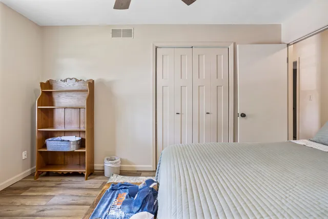 a view of room with wooden floor and cabinet