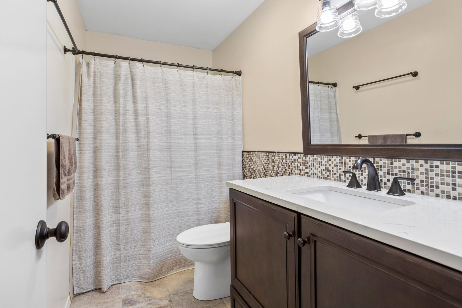 24 Crestview Court Fisher, IL 61843 - Photo 26 of 42 a bathroom with a sink a toilet a mirror and shower curtain