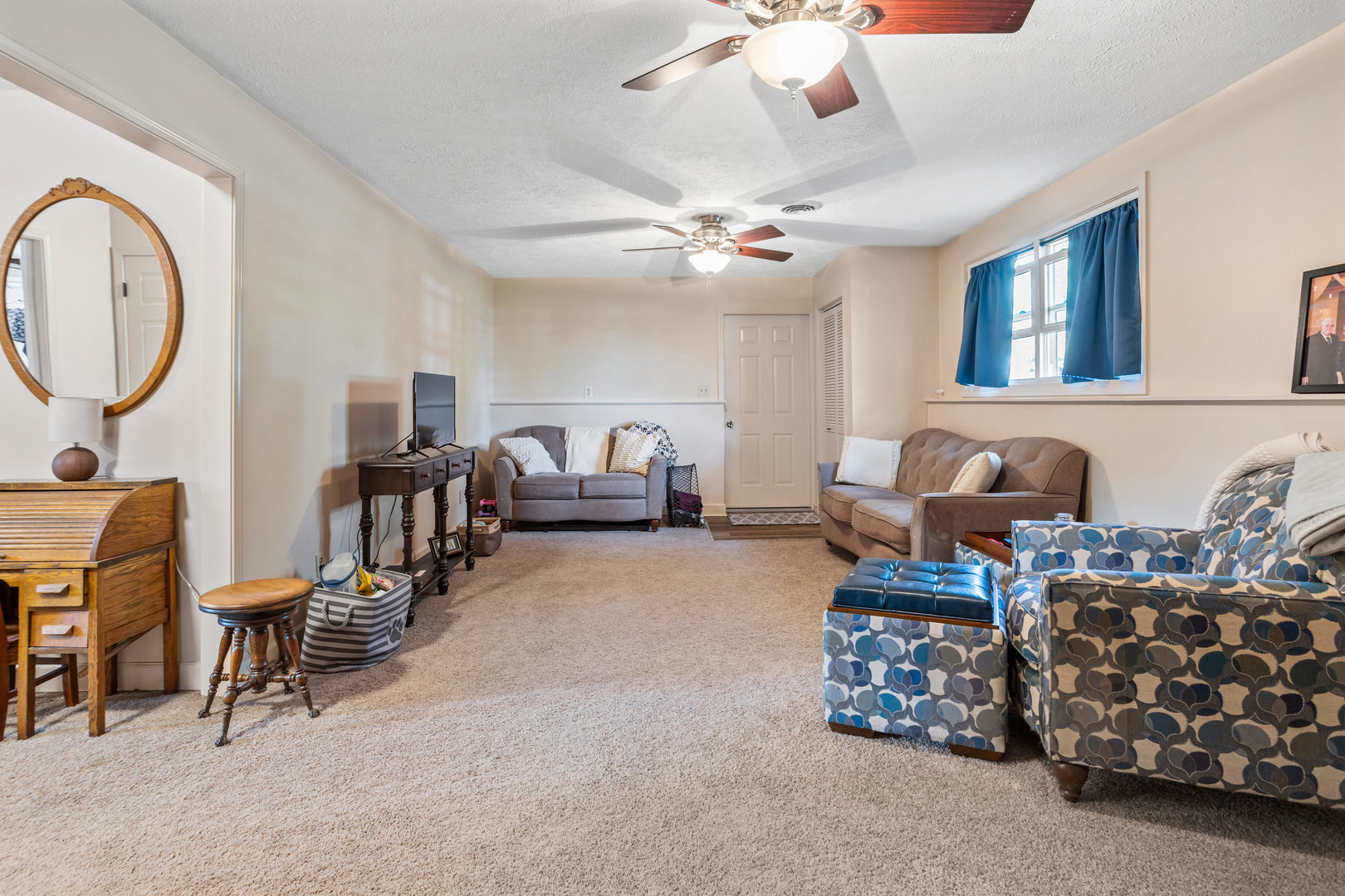 24 Crestview Court Fisher, IL 61843 - Photo 28 of 42 a living room with furniture and a chandelier