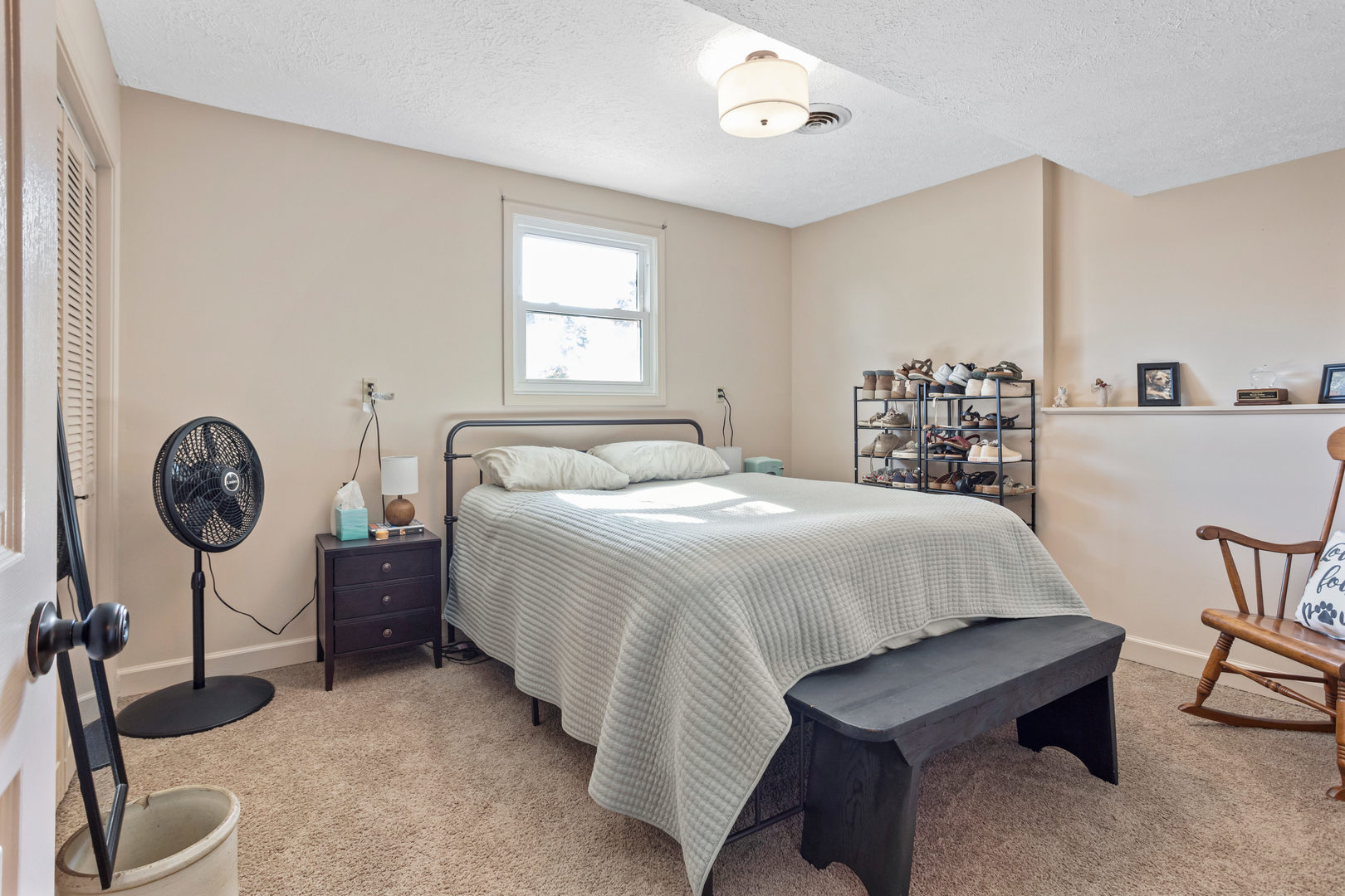 24 Crestview Court Fisher, IL 61843 - Photo 32 of 42 a bedroom with a bed a chair and potted plant on the table