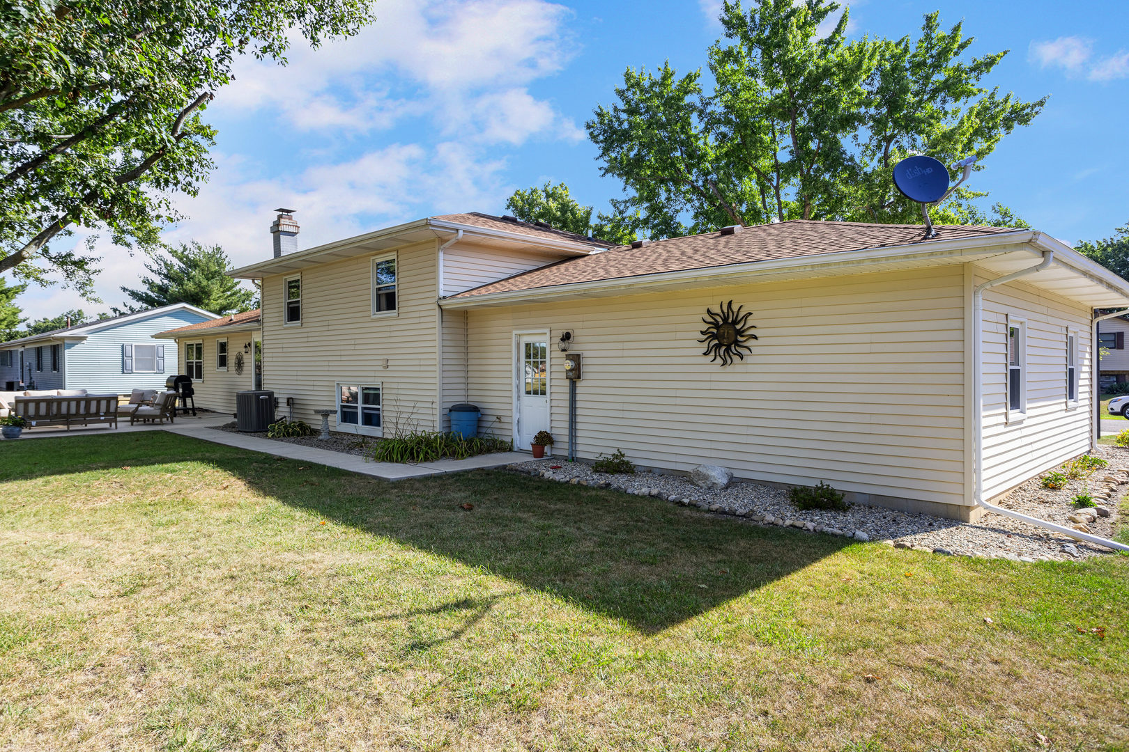 24 Crestview Court Fisher, IL 61843 - Photo 36 of 42 a view of a house with pool lawn chairs and a barbeque