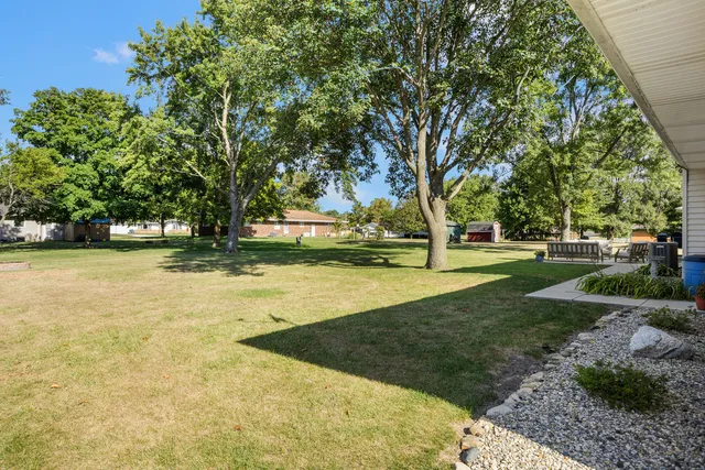 a view of a yard with swimming pool