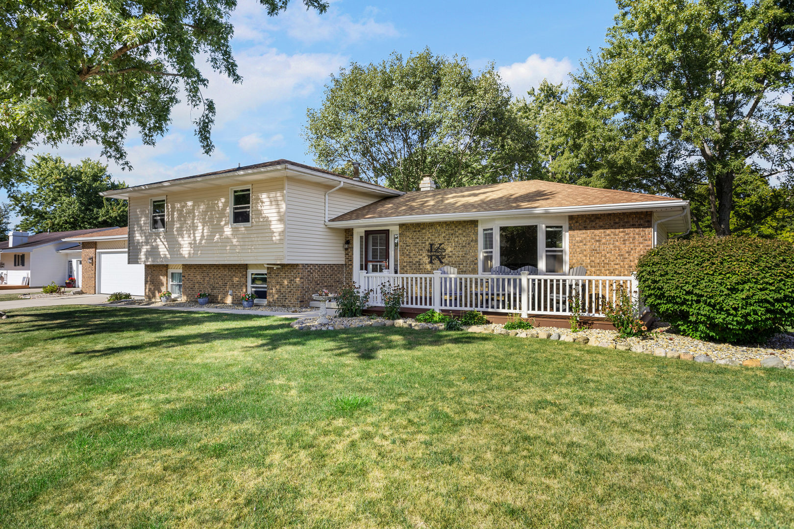 24 Crestview Court Fisher, IL 61843 - Photo 39 of 42 a front view of a house with a garden