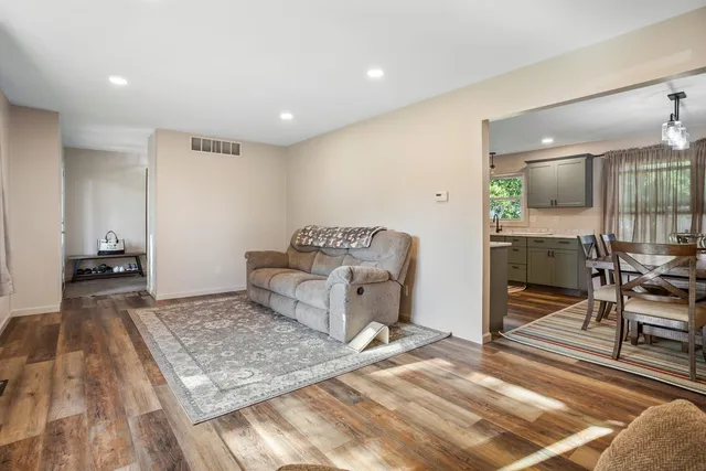 a living room with furniture and a table