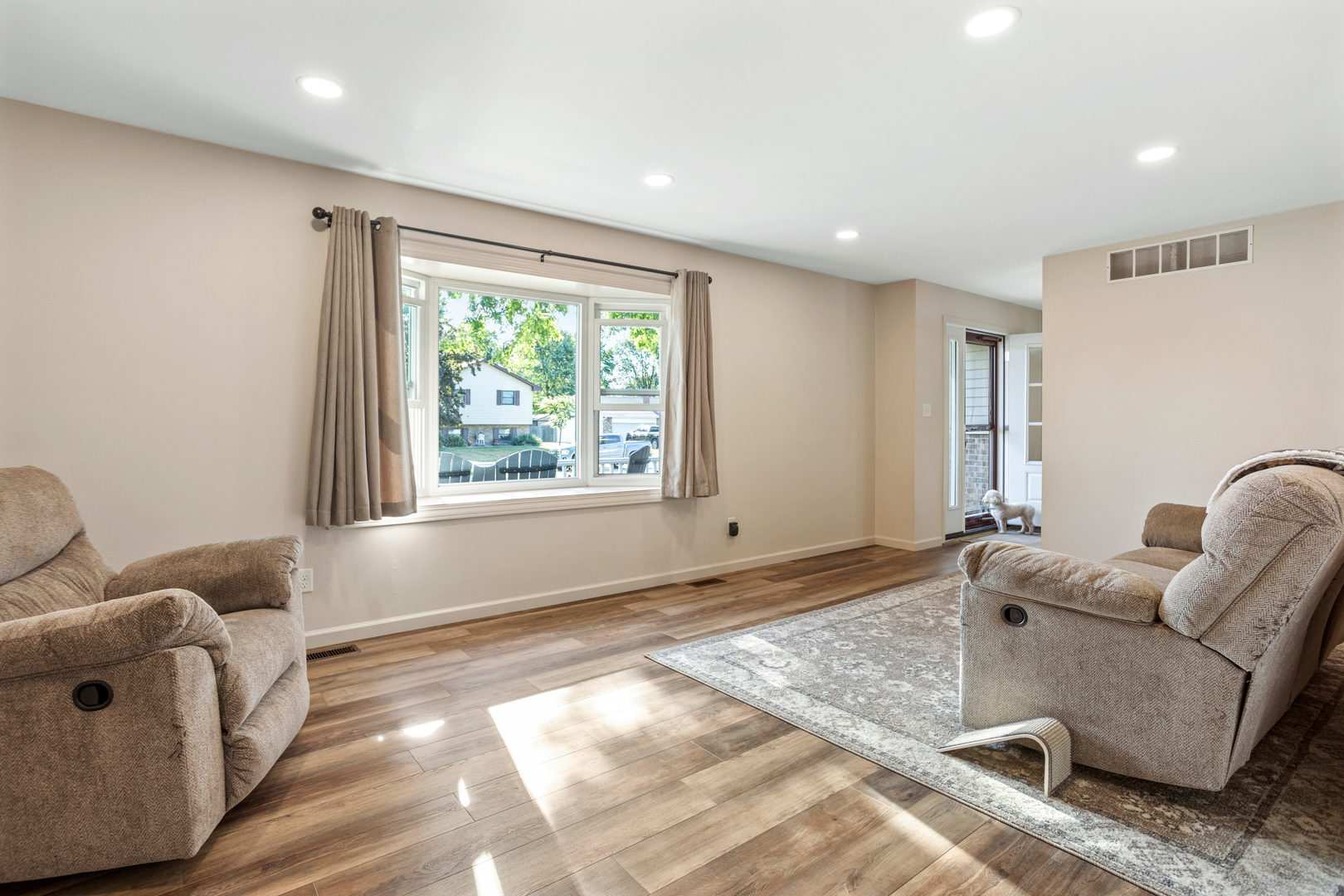 24 Crestview Court Fisher, IL 61843 - Photo 9 of 42 a living room with furniture and a large window