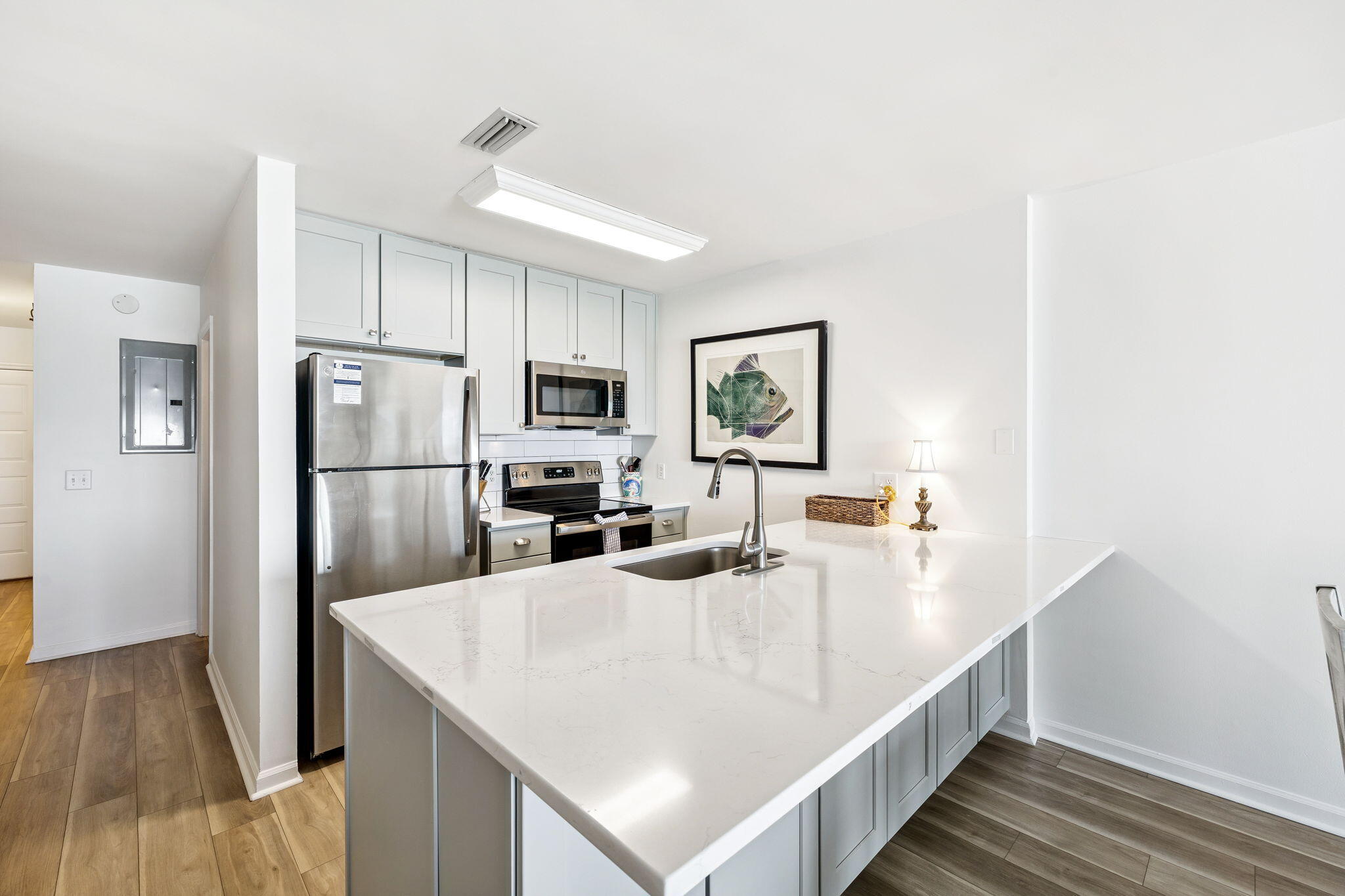 8116 East County Highway 30A, Unit 5 Inlet Beach, FL 32461 - Photo 12 of 48 a kitchen with stainless steel appliances a refrigerator and a stove