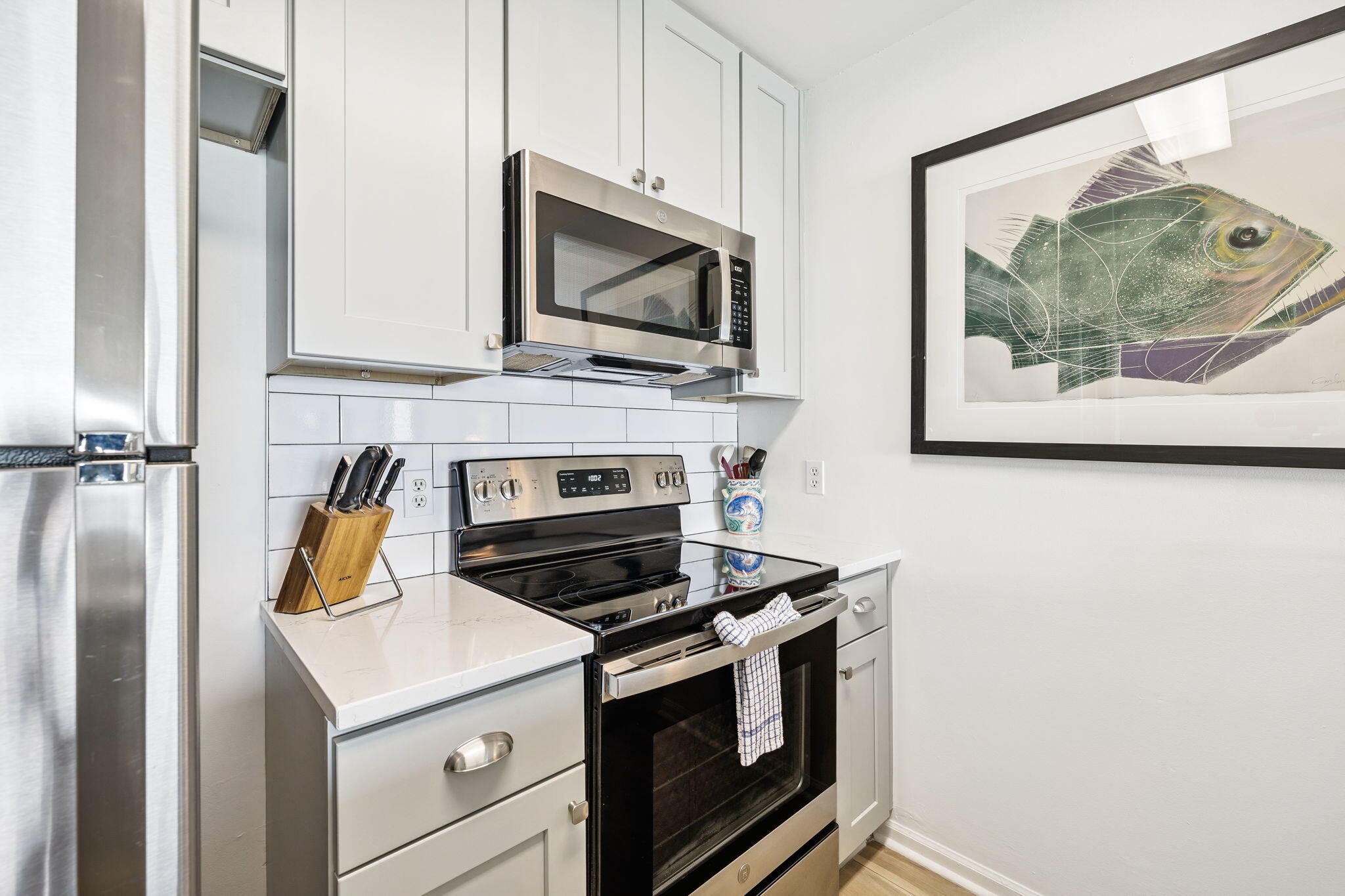 8116 East County Highway 30A, Unit 5 Inlet Beach, FL 32461 - Photo 14 of 48 a kitchen with a stove and a microwave