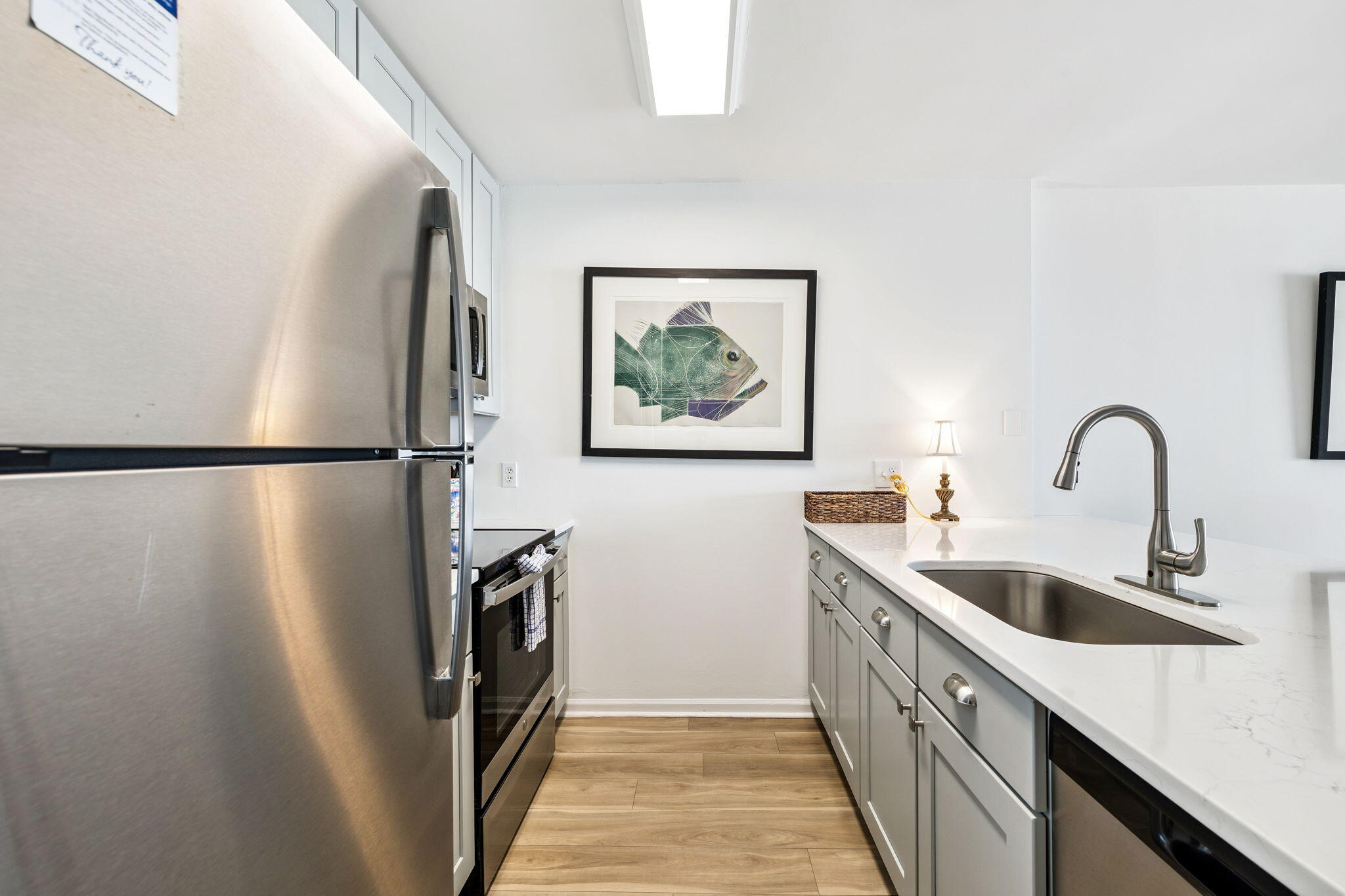 8116 East County Highway 30A, Unit 5 Inlet Beach, FL 32461 - Photo 15 of 48 a kitchen with a refrigerator and a sink