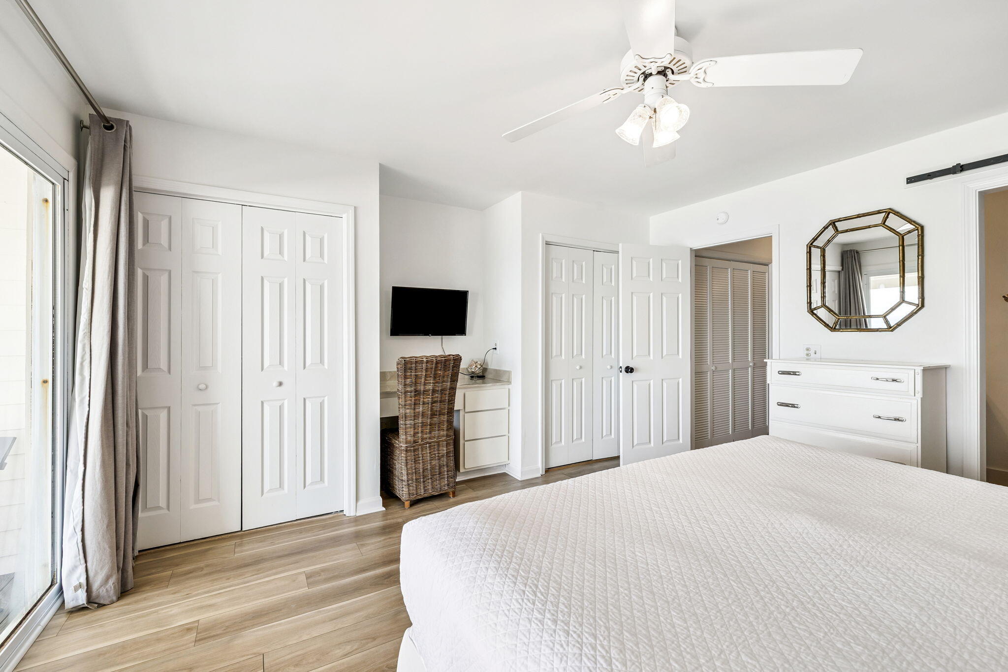 8116 East County Highway 30A, Unit 5 Inlet Beach, FL 32461 - Photo 22 of 48 a bedroom with a bed and a chandelier