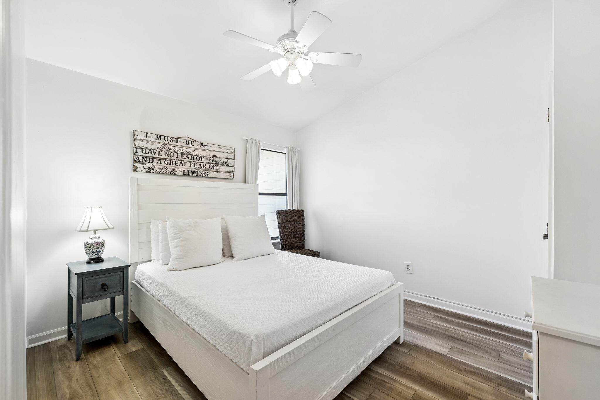 8116 East County Highway 30A, Unit 5 Inlet Beach, FL 32461 - Photo 25 of 48 a bedroom with a bed and a chandelier