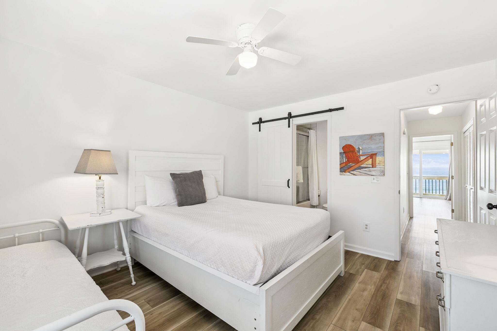 8116 East County Highway 30A, Unit 5 Inlet Beach, FL 32461 - Photo 31 of 48 a bedroom with a bed and a lamp