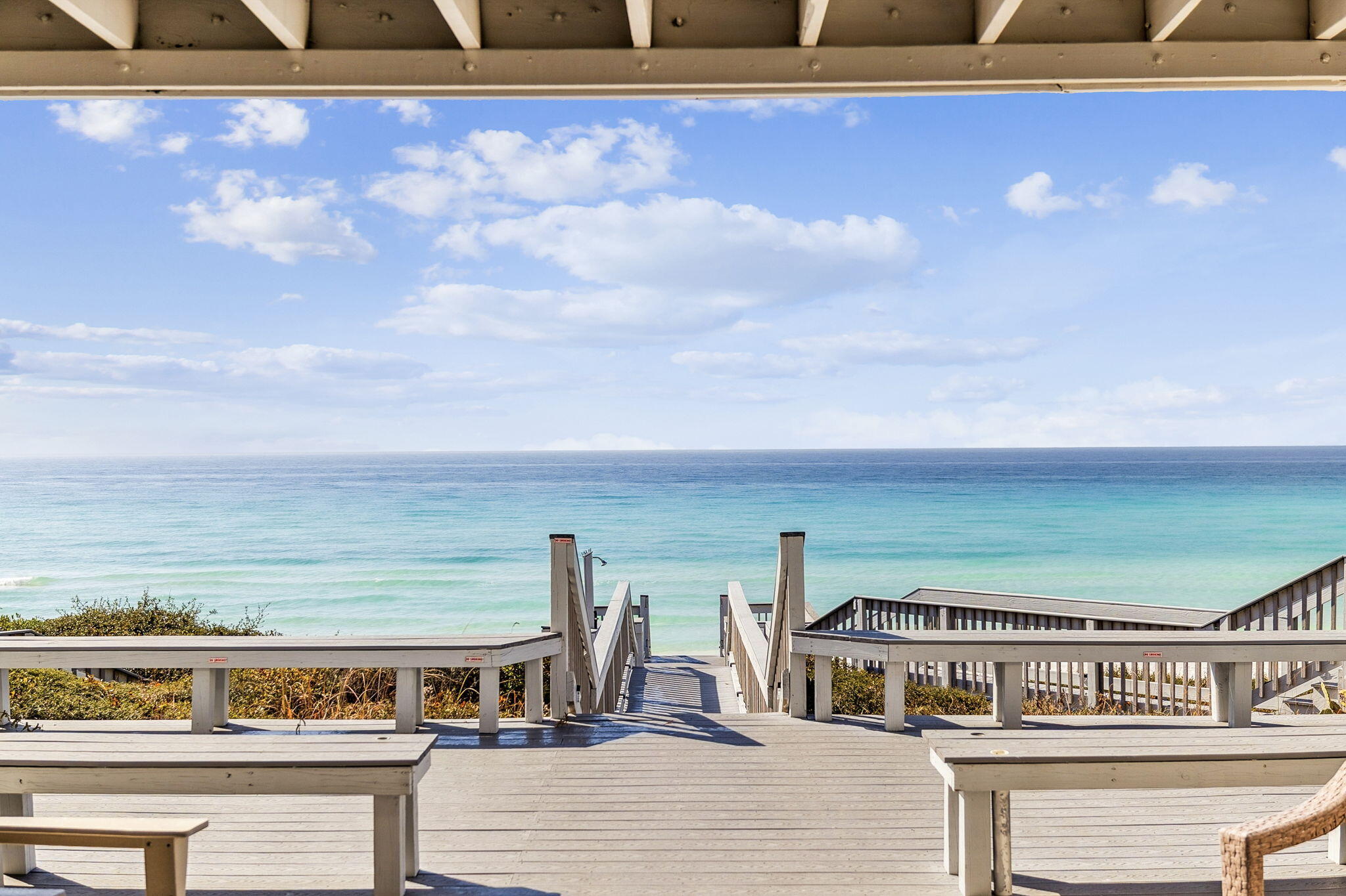 8116 East County Highway 30A, Unit 5 Inlet Beach, FL 32461 - Photo 36 of 48 a roof deck with a table and chairs