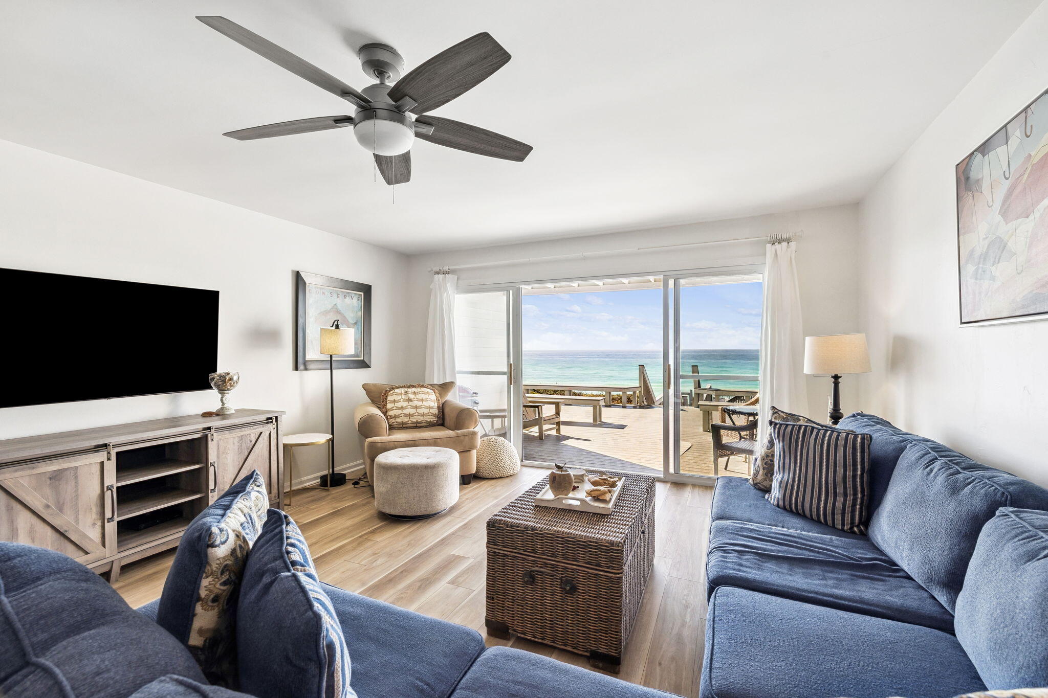 8116 East County Highway 30A, Unit 5 Inlet Beach, FL 32461 - Photo 4 of 48 a living room with furniture a flat screen tv and a large window