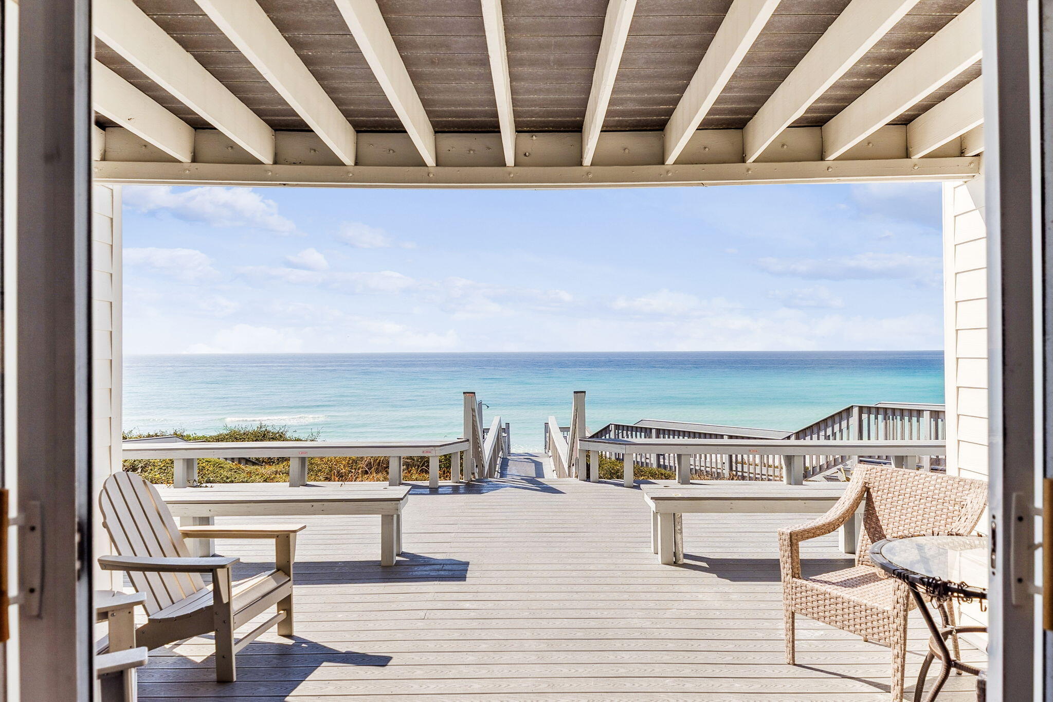 8116 East County Highway 30A, Unit 5 Inlet Beach, FL 32461 - Photo 6 of 48 a view of a balcony with chairs and wooden floor