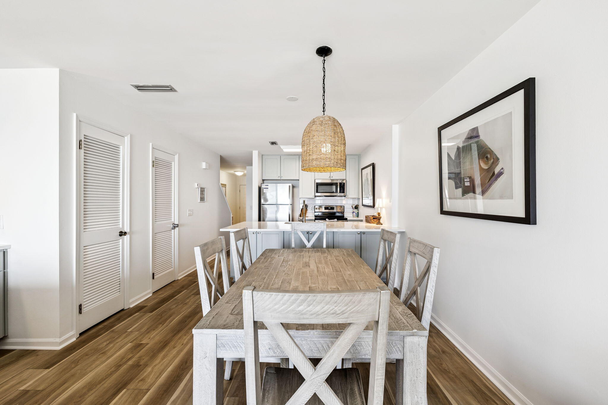8116 East County Highway 30A, Unit 5 Inlet Beach, FL 32461 - Photo 9 of 48 a view of a dining room with furniture window and wooden floor