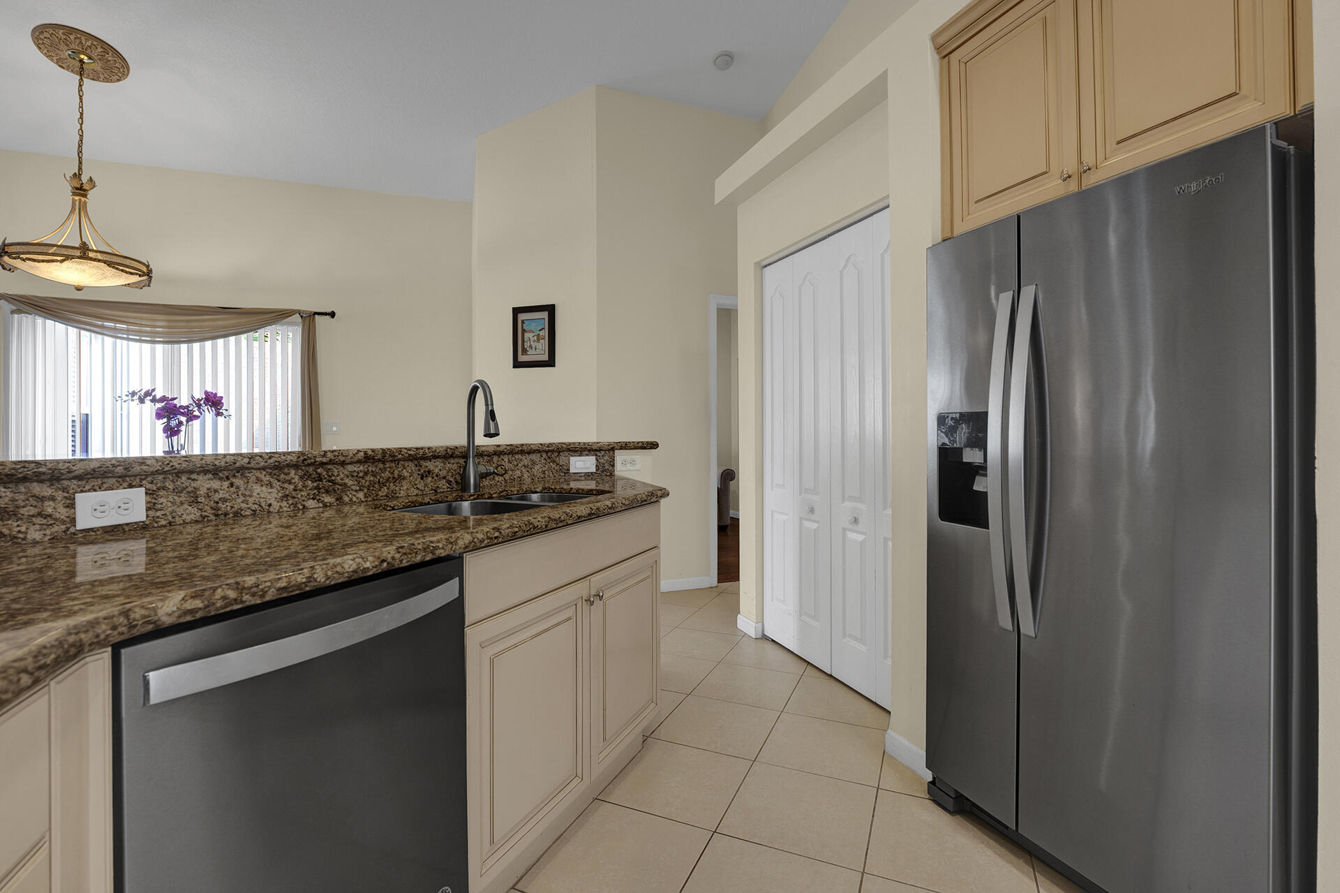5803 Raceway Road Lake Worth, FL 33449 - Photo 8 of 49 a kitchen with stainless steel appliances granite countertop a refrigerator and a sink