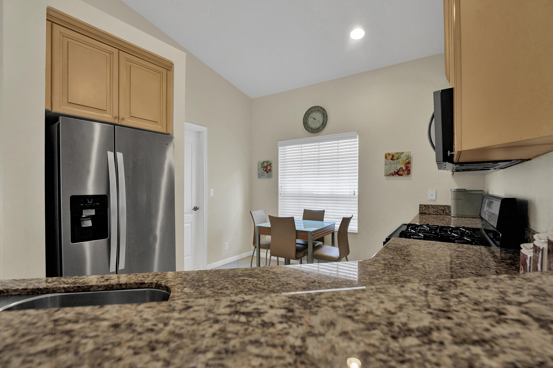 5803 Raceway Road Lake Worth, FL 33449 - Photo 10 of 49 a kitchen with stainless steel appliances granite countertop a refrigerator stove and sink