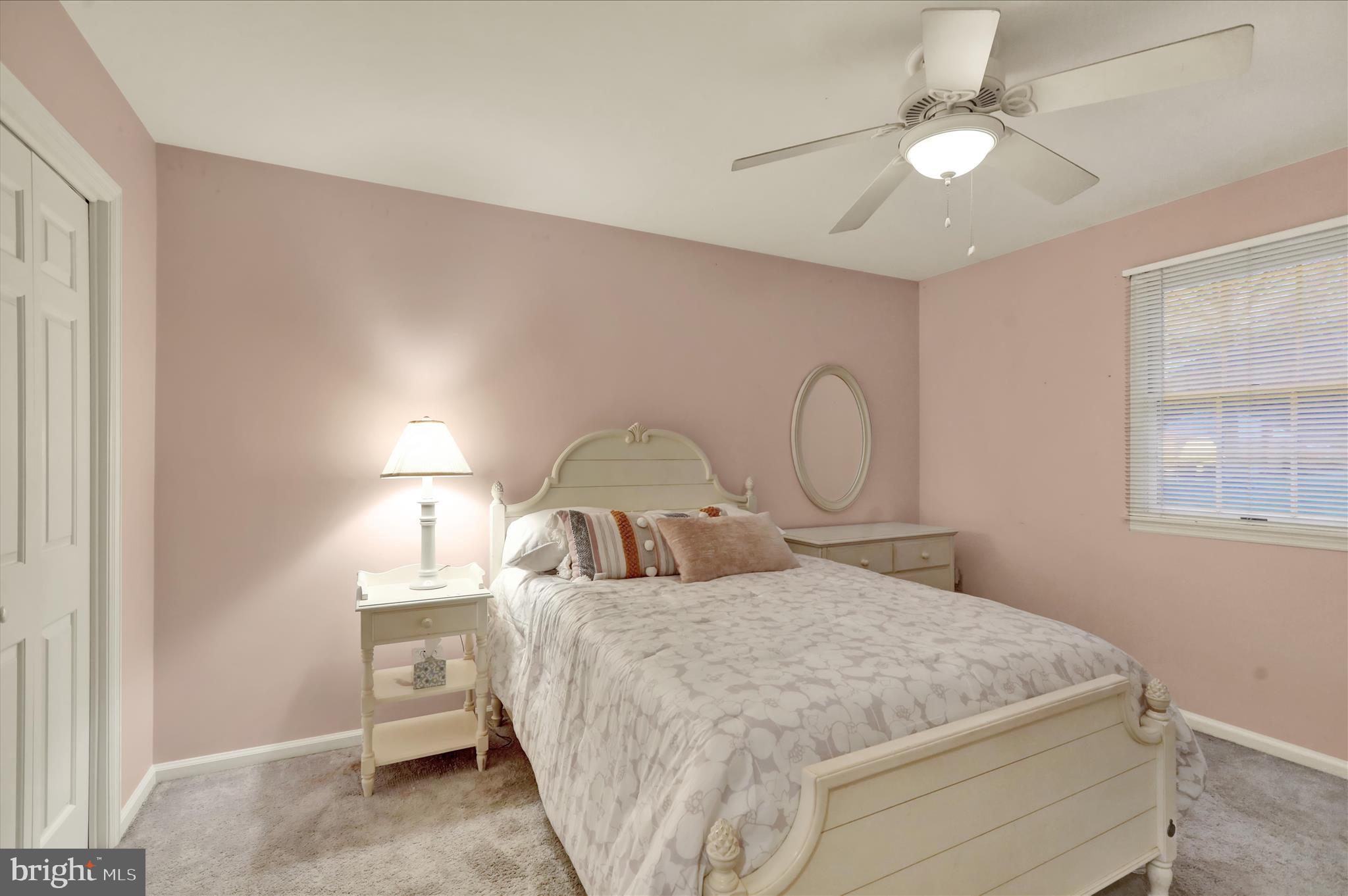 314 Fairview Road Reading, PA 19606 - Photo 30 of 45 a bedroom with a bed and a chandelier