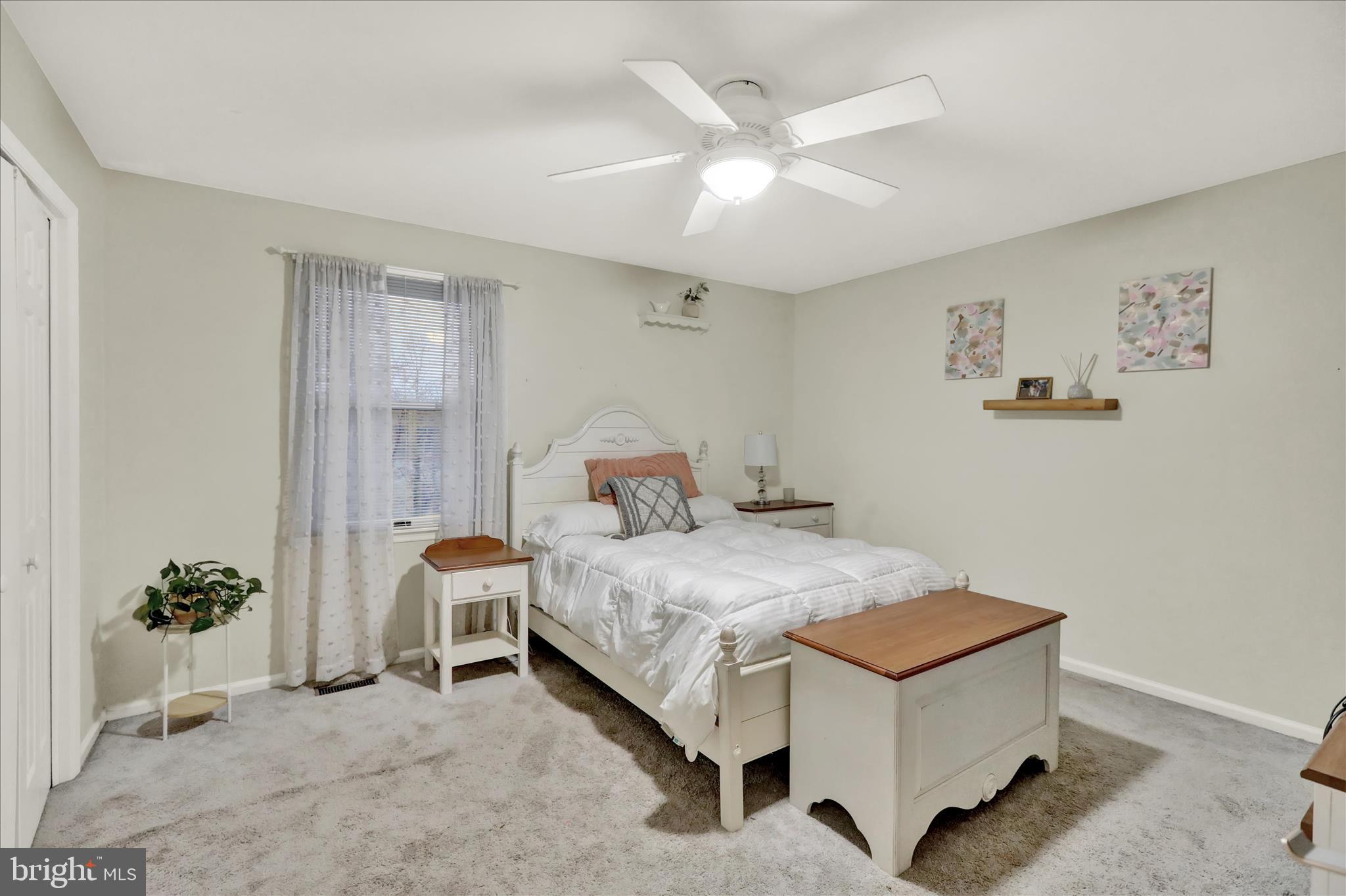 314 Fairview Road Reading, PA 19606 - Photo 32 of 45 a bed room with a bed and a potted plant