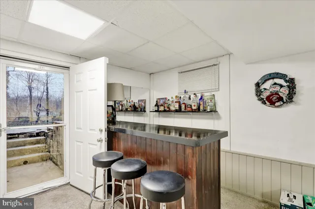a kitchen with stainless steel appliances granite countertop a sink and a refrigerator
