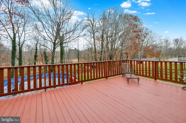 a view of wooden deck and a trees