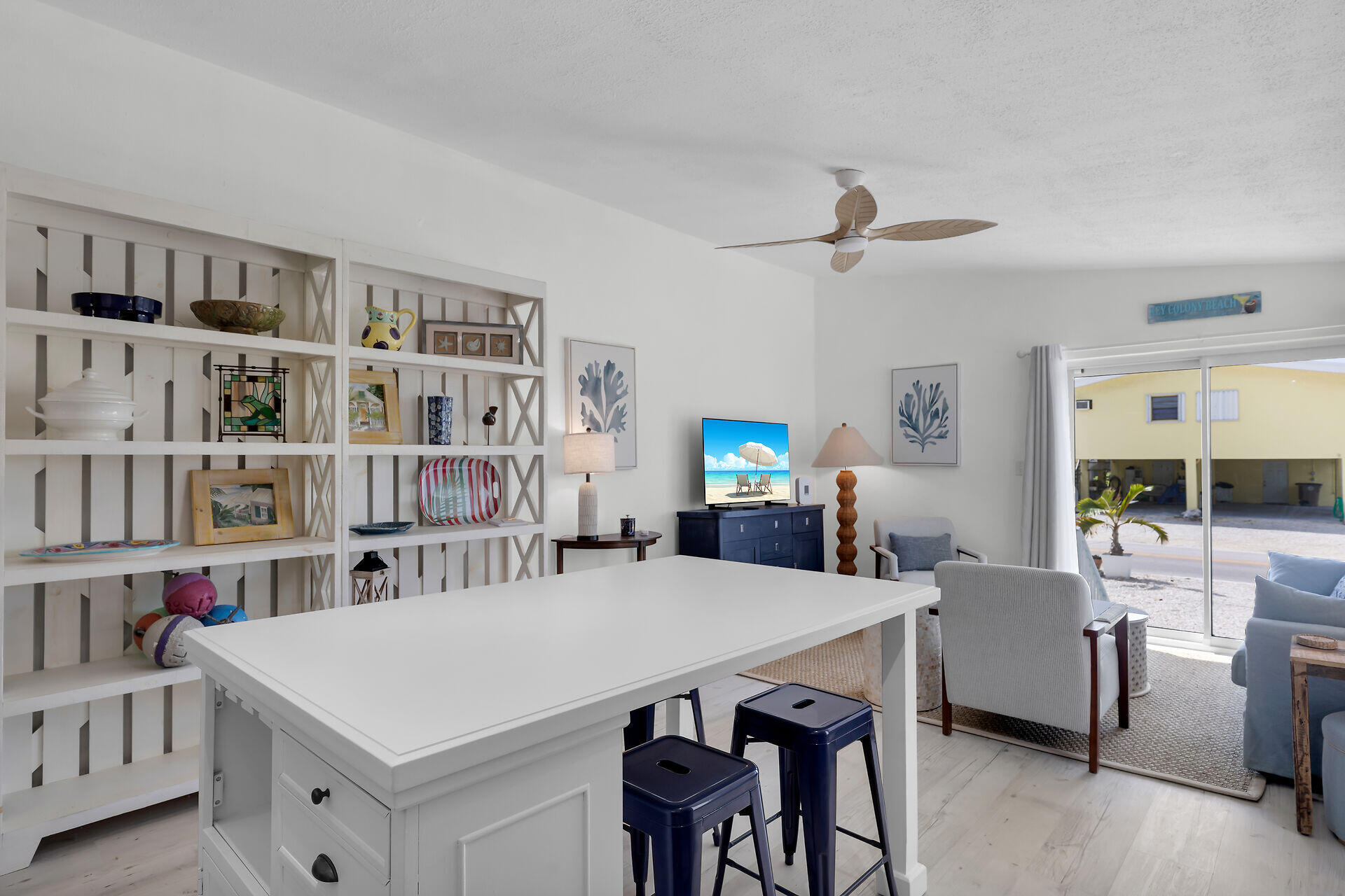10 Clara Boulevard Marathon, FL 33051 - Photo 11 of 25 a view of a dining room with furniture and a book shelf