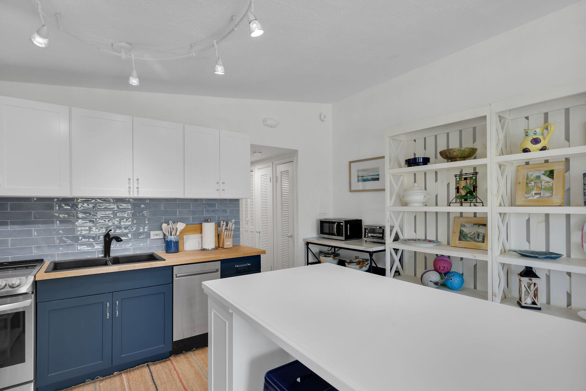 10 Clara Boulevard Marathon, FL 33051 - Photo 12 of 25 a kitchen with stainless steel appliances a stove and cabinets