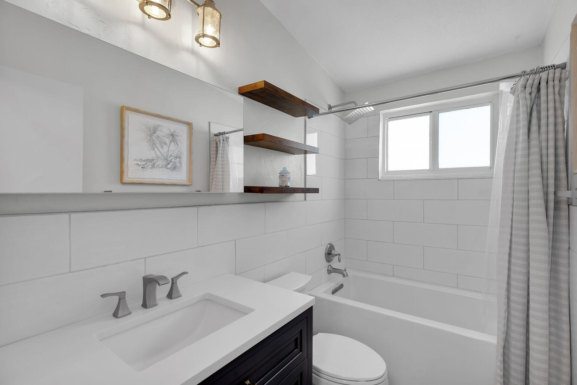 10 Clara Boulevard Marathon, FL 33051 - Photo 17 of 25 a bathroom with a sink toilet a mirror and bathtub