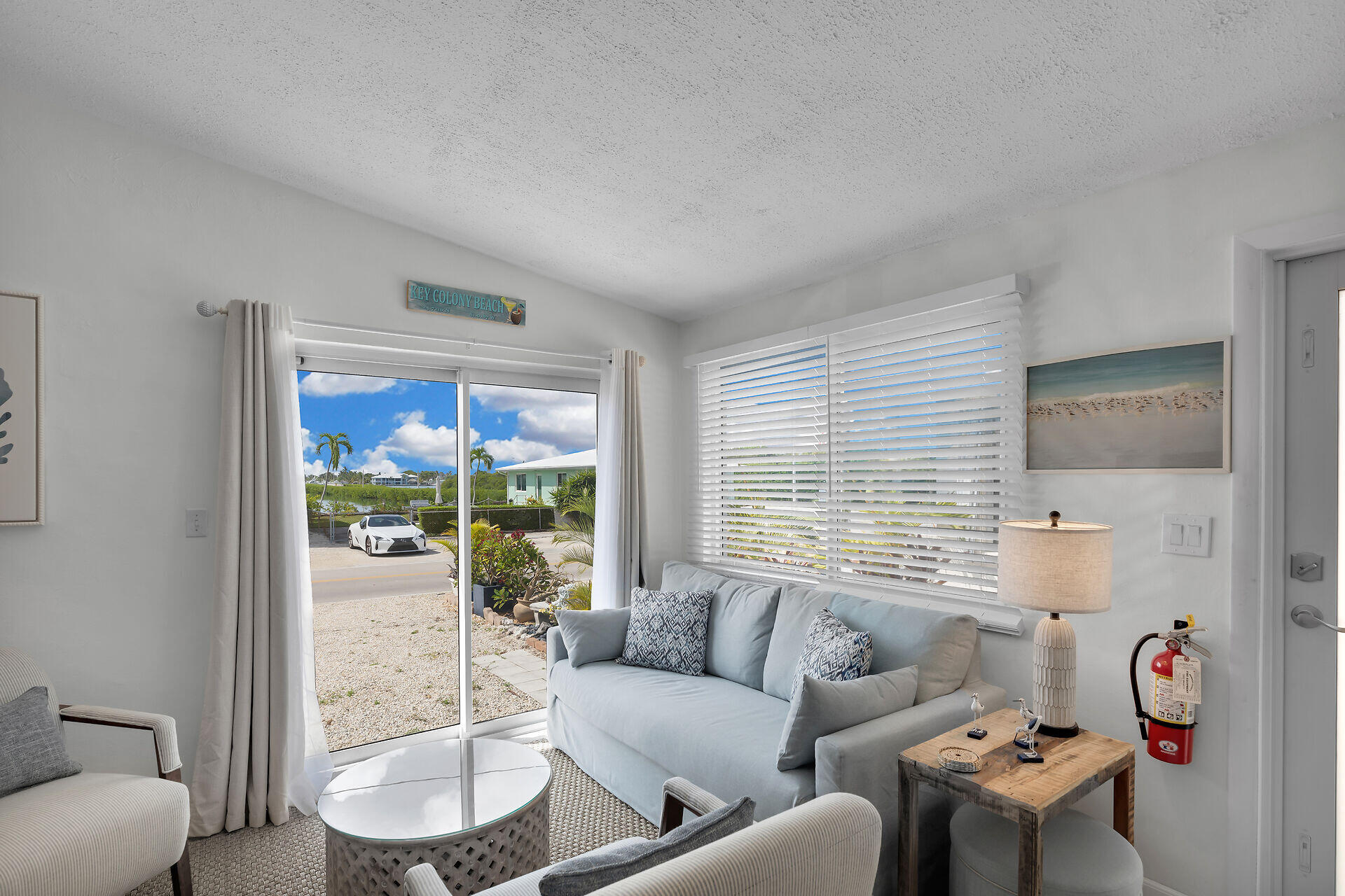 10 Clara Boulevard Marathon, FL 33051 - Photo 3 of 25 a living room with furniture and a large window