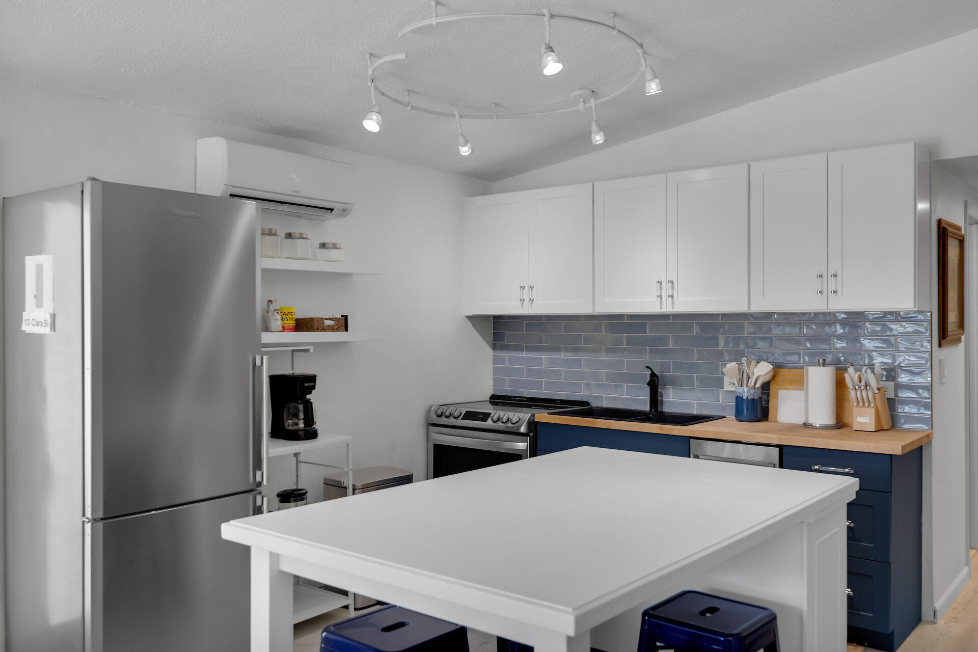 10 Clara Boulevard Marathon, FL 33051 - Photo 9 of 25 a kitchen with stainless steel appliances a refrigerator and a stove top oven