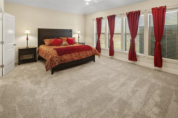 a bedroom with a bed and a large walk in closet