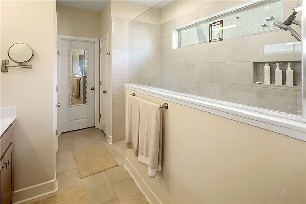 a view of a hallway with wooden shelves