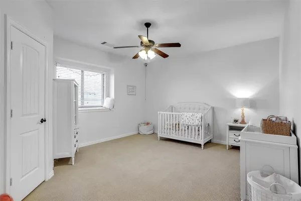 a bedroom with furniture and window