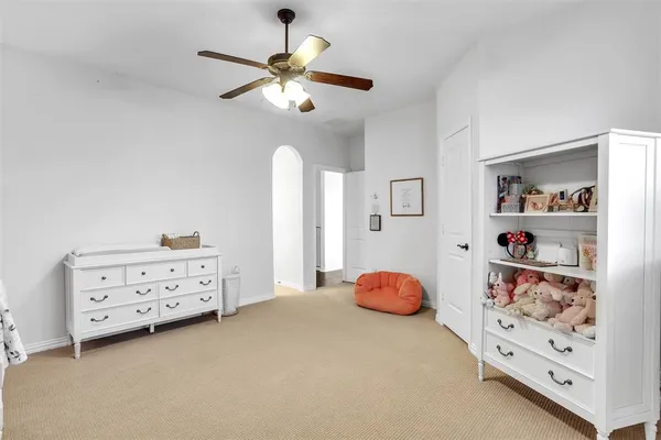 a bathroom with a granite countertop sink toilet mirror and shower
