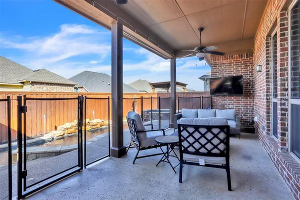 a balcony with furniture and outdoor view