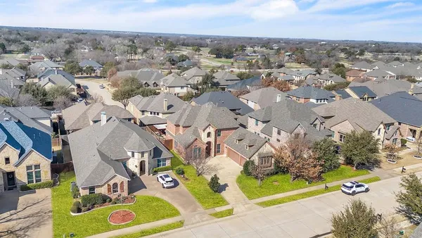 an aerial view of a house with a garden