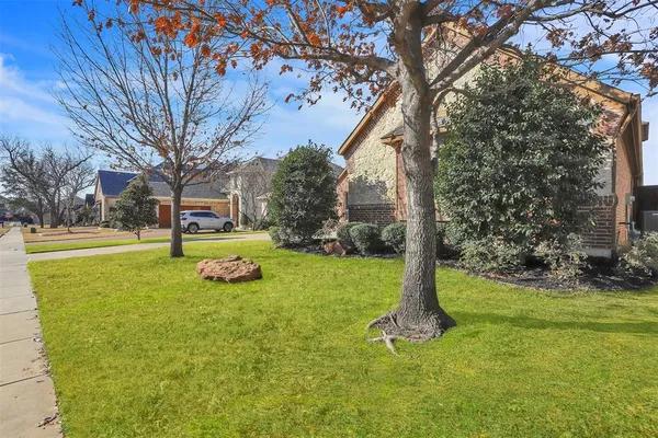 a view of a playground with basketball court