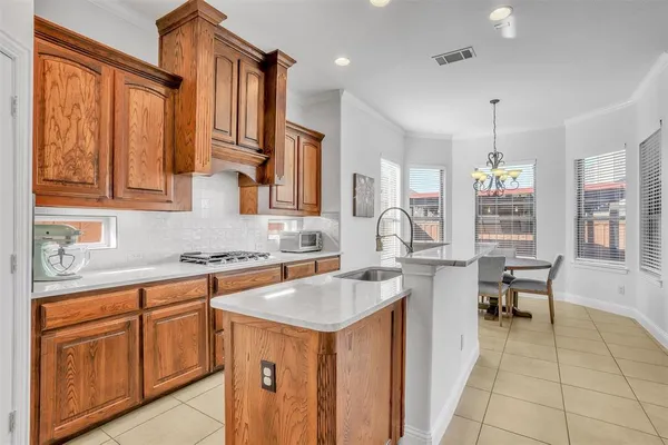 a kitchen with a stove and a sink