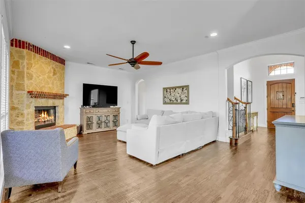 a view of a dining room with furniture wooden floor and a chandelier