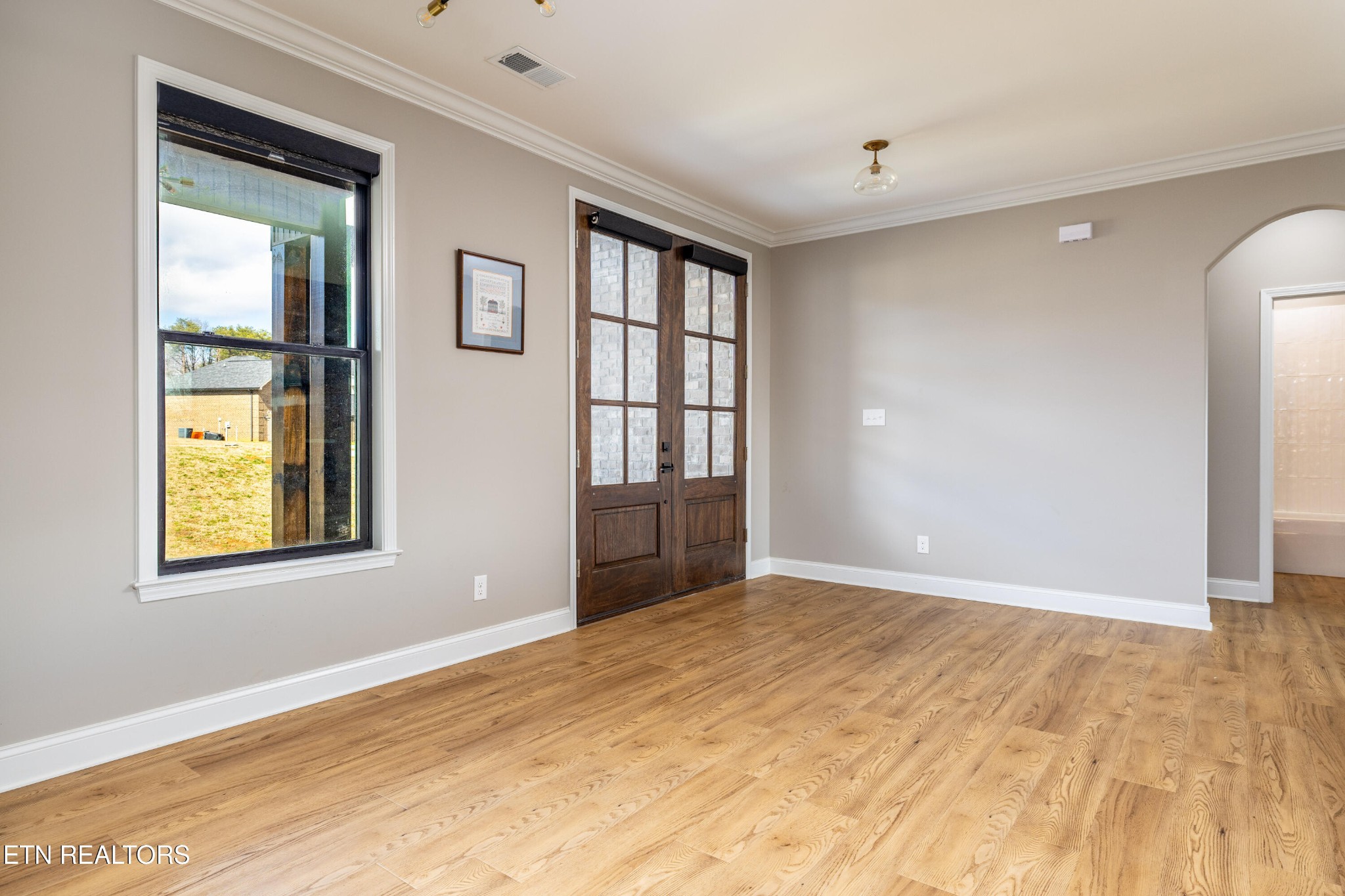 1216 Houston Springs Road Greenback, TN 37742 - Photo 13 of 57 a view of an empty room with window and wooden floor