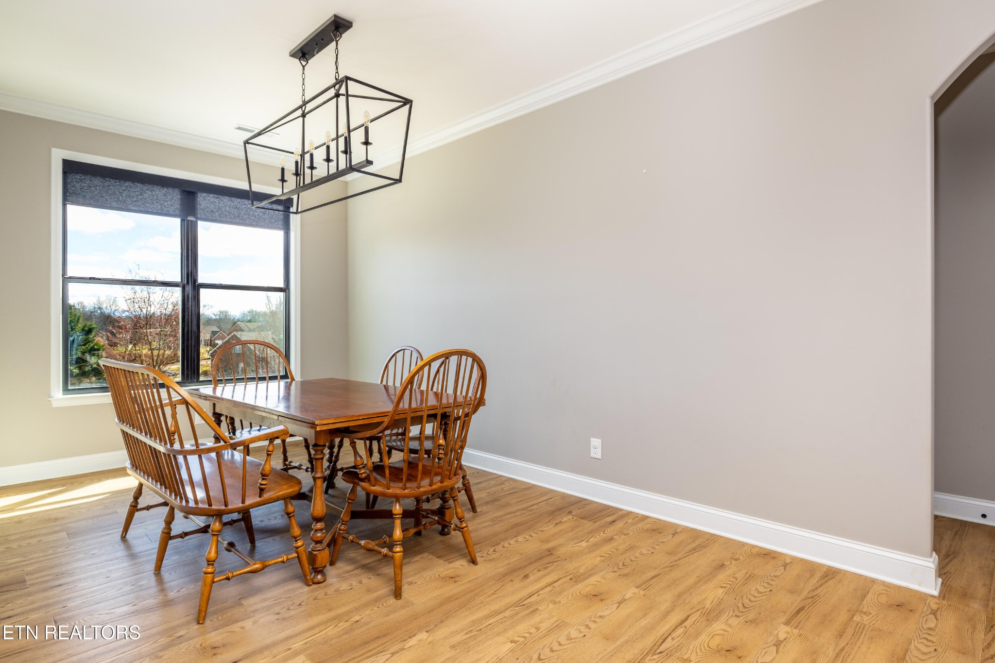 1216 Houston Springs Road Greenback, TN 37742 - Photo 22 of 57 a view of a dining room with furniture window and wooden floor