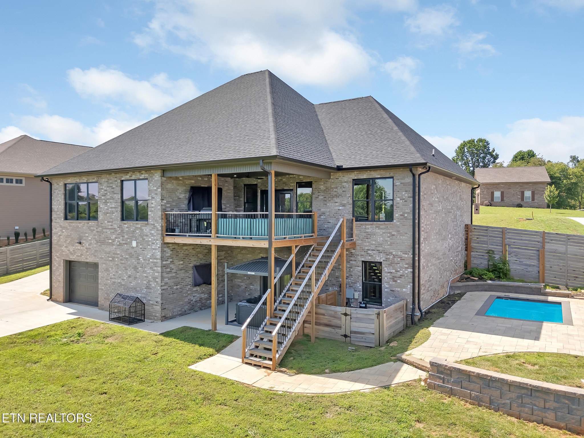 1216 Houston Springs Road Greenback, TN 37742 - Photo 50 of 57 a view of a house with swimming pool and porch